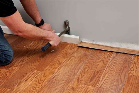What should I put down before installing hardwood floors?